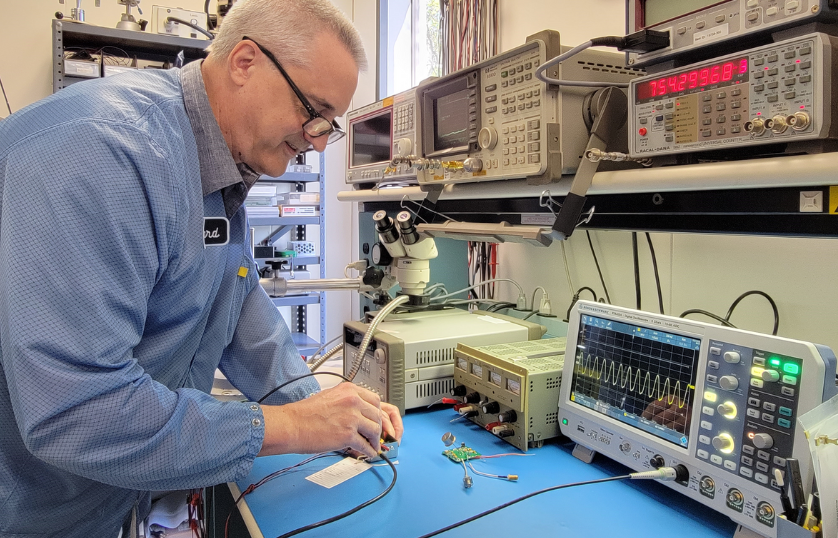 Quantic WMD Homepage Man in Facility Interior Lab Image